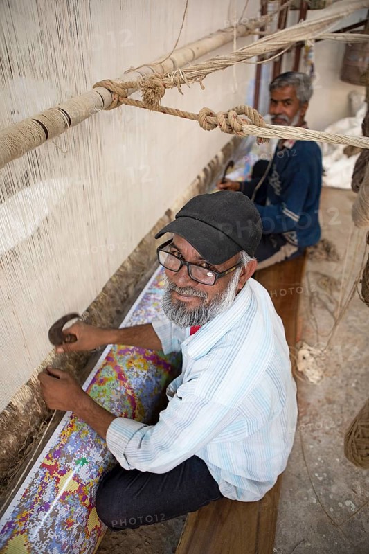Indian men weaving a carpet, Jaipur, Rajasthan, India