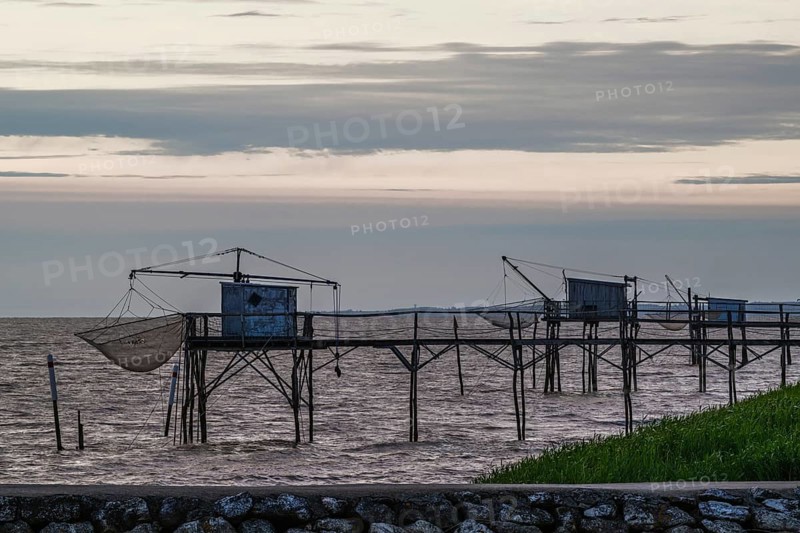 Sunset over Fishing huts over Randonnee entre Histoire et Nature, Fouras, Fouras-les-Bains, Charente-Maritime, Nouvelle-Aquitaine, France
