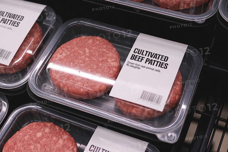 Eef patties in refrigerator at supermarket. Concept of lab-grown artificial meat as sustainable alternative. Generative AI, AI generated