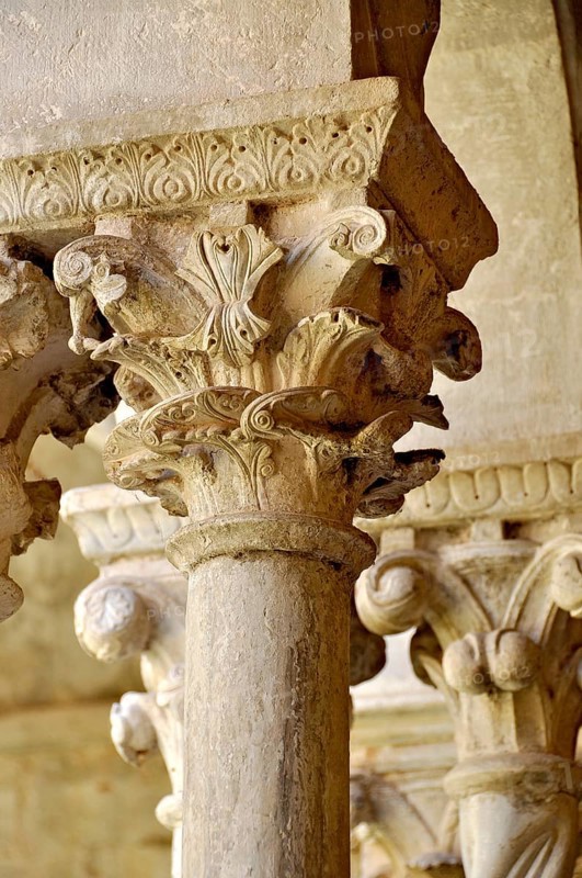 Slender Gothic columns with filigree capitals in the cloister, Gothic basilica of the Cistercian Abbey of Fossanova, Cistercian-Burgundian architectural style, Priverno, Province of Latina, Lazio, Italy