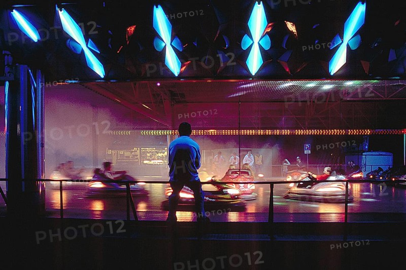 Illuminated bumper cars at night, New Jersey, USA