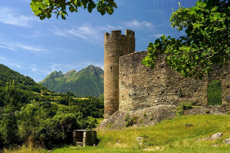 The ruins of the Château Sainte-Marie castle in Esterre and the mountain landscape near Luz-Saint-Sauveur, Pyrenees, France
