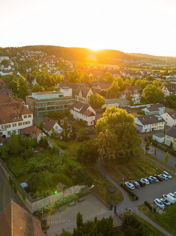 Landscape with a village car park at sunset, surrounded by trees and a quiet atmosphere, 950 years Weil der Stadt ceremony, Böblingen district, Germany