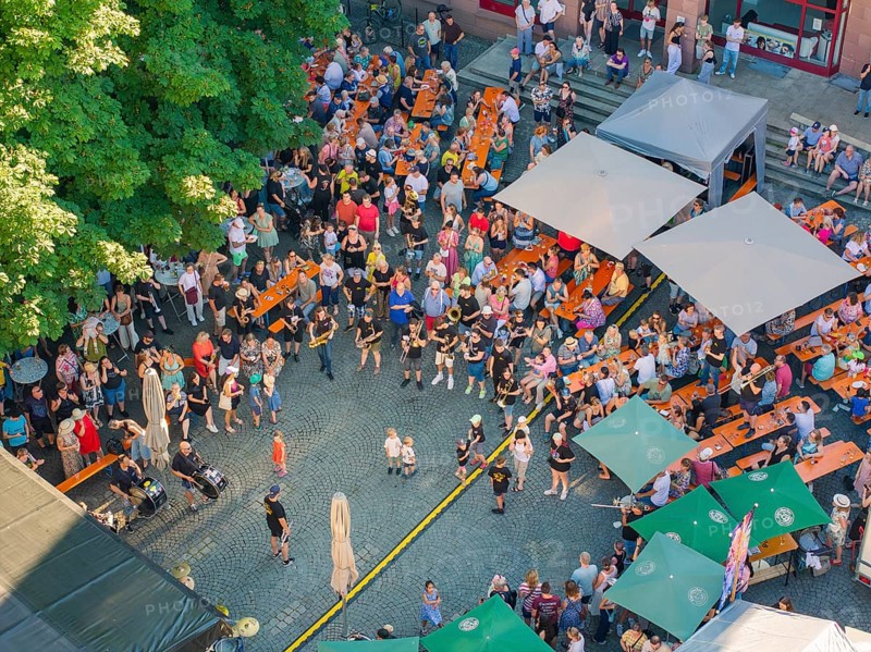 Large crowd at an outdoor event in a paved square, 950 years Weil der Stadt ceremony, Böblingen district, Germany
