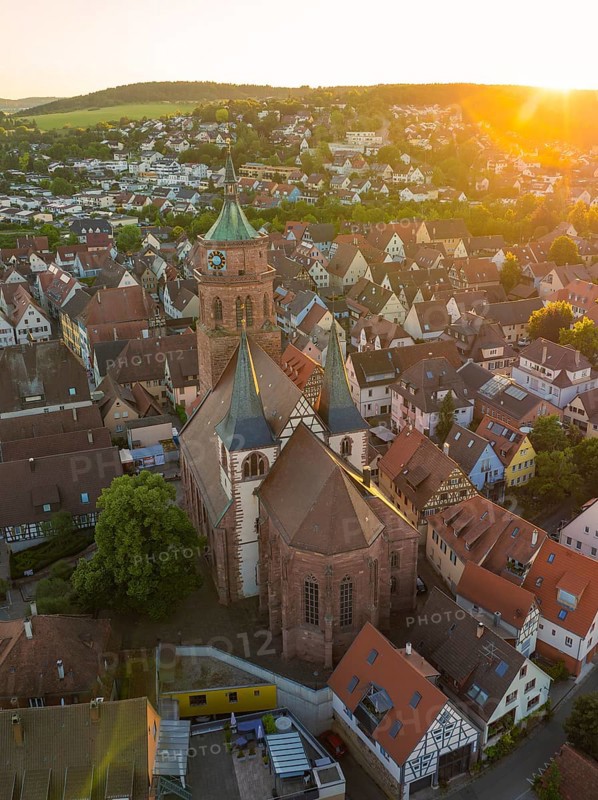 Aerial view of a church and old town centre in the evening light with surrounding landscape, 950 years Weil der Stadt ceremony, Böblingen district, Germany