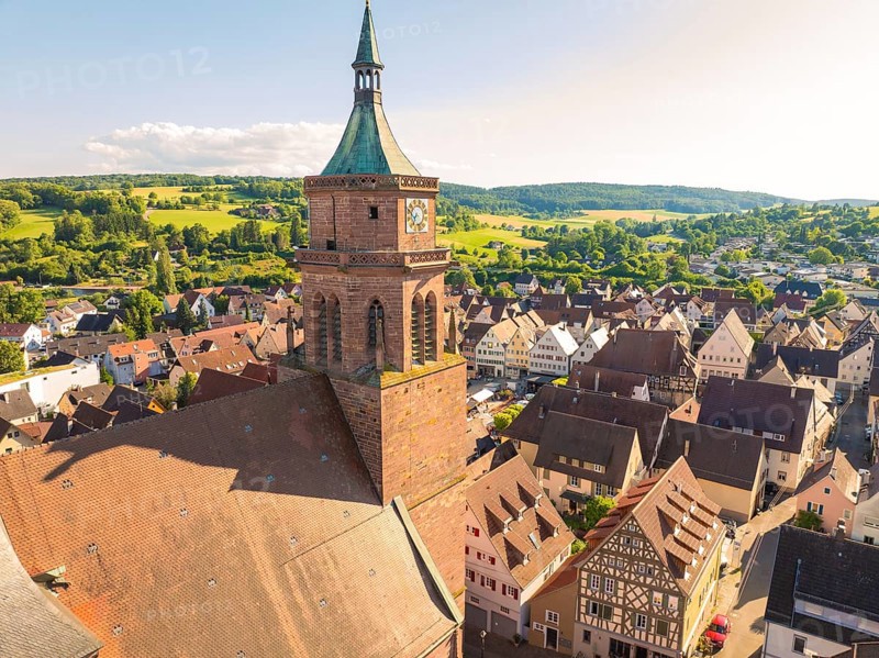 Church tower overlooks a hilly, rural landscape and a village with half-timbered houses, 950 years Weil der Stadt ceremony, Böblingen district, Germany