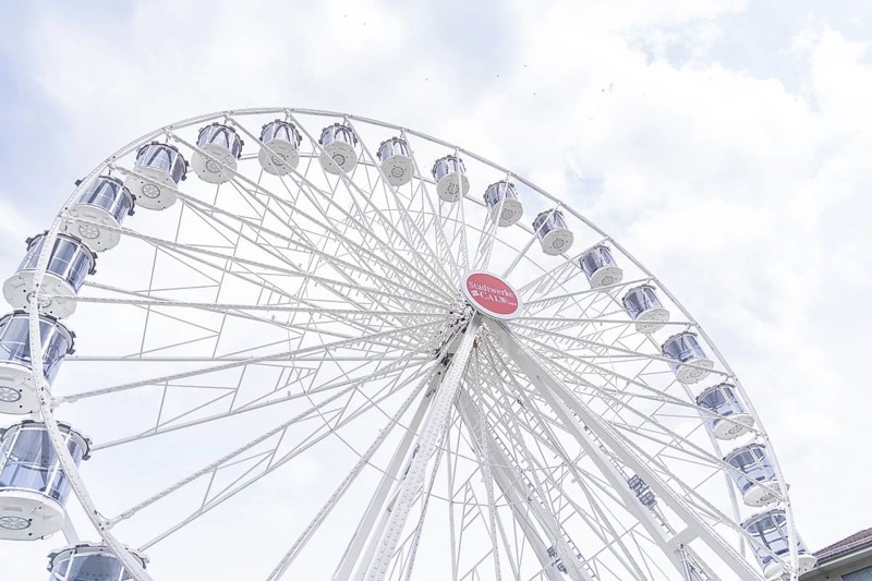 Modern Ferris wheel with gondolas in front of a slightly cloudy sky, Ferris wheel construction, Calw, Germany