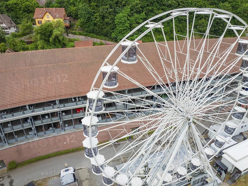 Close-up of the Ferris wheel with detailed view of the cabins and buildings in the background, Ferris wheel construction, Calw, Black Forest, Germany