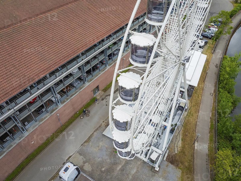 Detailed view of the Ferris wheel cabins next to a road and building, Ferris wheel construction, Calw, Black Forest, Germany