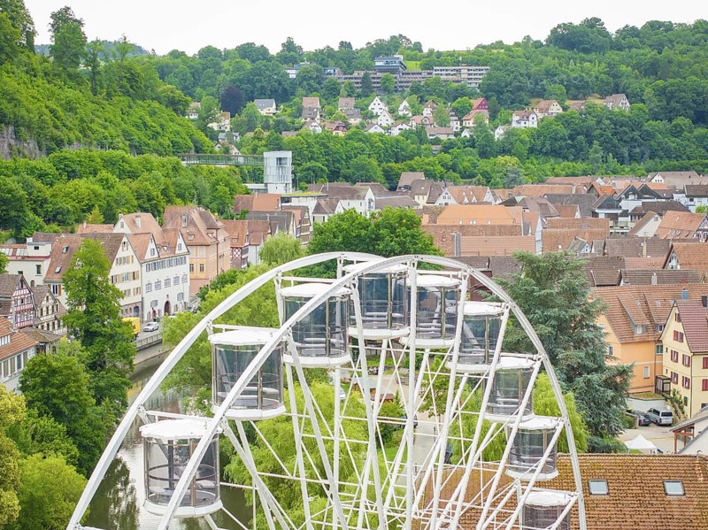 Ferris wheel towers over the rooftops and offers views of the surrounding hills, Ferris wheel construction, Calw, Black Forest, Germany