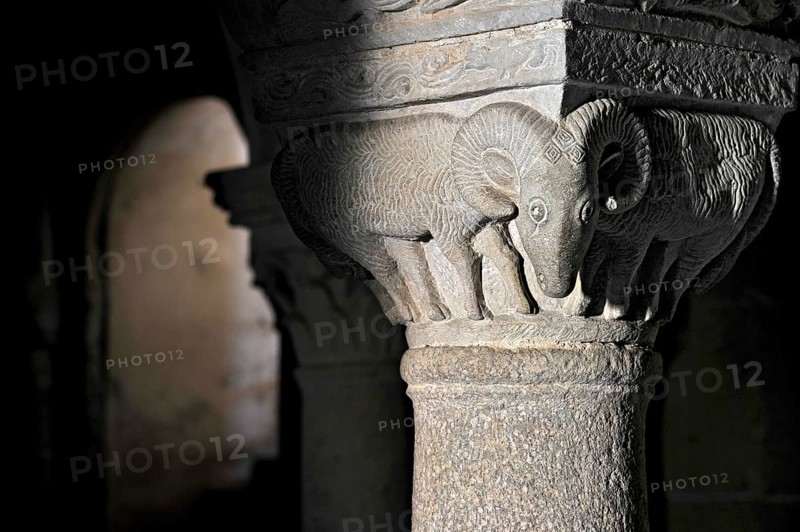 Column capital with ram, relief in stone, underground grove of columns, pagan crypt, 10th century, gloomy illumination, Cathedral of Acquapendente, Basilica of the Holy Sepulchre, Basilica Santo Sepolcro, Basilica minor, Aquapendente, Province of Viterbo, Lazio, Italy