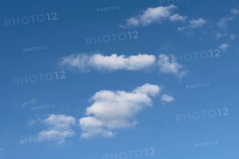 White clouds Altocumulus in front of blue sky. international
