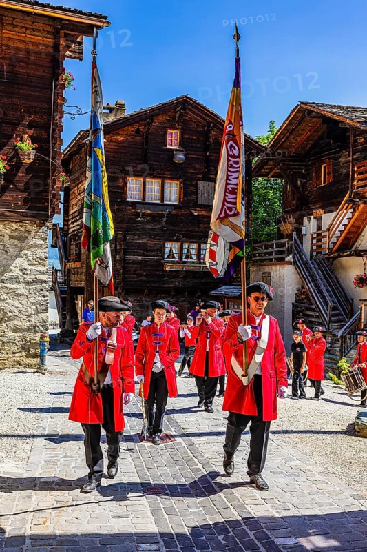 Pipers and drummers accompany the Corpus Christi procession, historic town centre, Grimentz, Val d'Anniviers, Valais Alps, Canton Valais, Switzerland