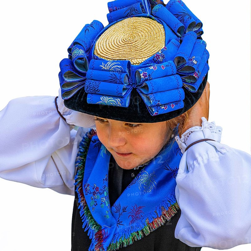 Young girl in traditional traditional costume and with traditional hat, Grimentz, Val d'Anniviers, Valais Alps, Canton Valais, Switzerland