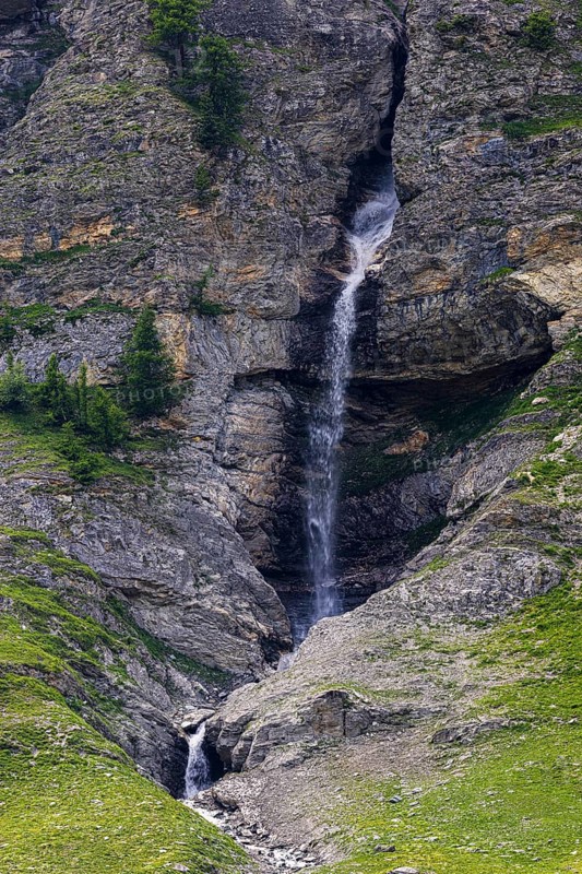 Waterfall cascading down a rock face, Zinal Valley, Val d'Anniviers, Valais Alps, Canton Valais, Switzerland