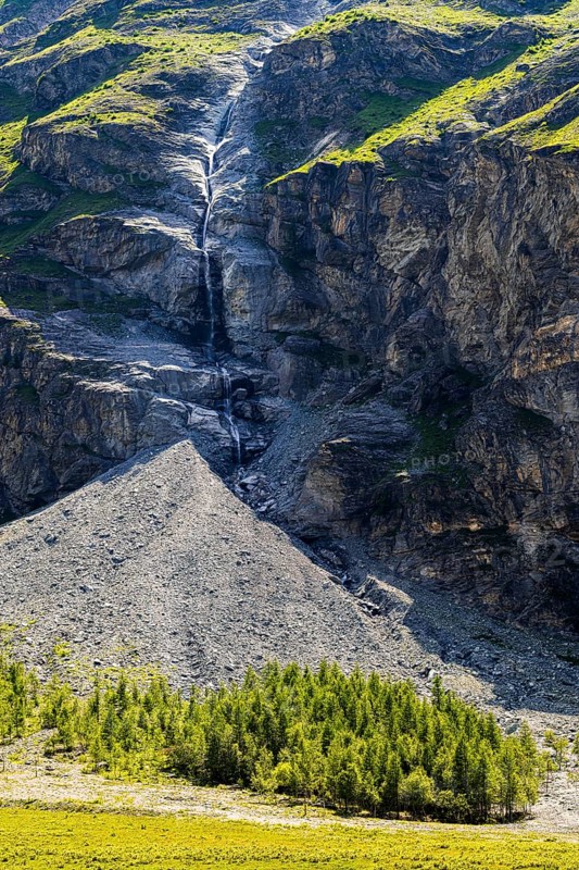 Waterfall cascading down a rock face, Zinal Valley, Val d'Anniviers, Valais Alps, Canton Valais, Switzerland