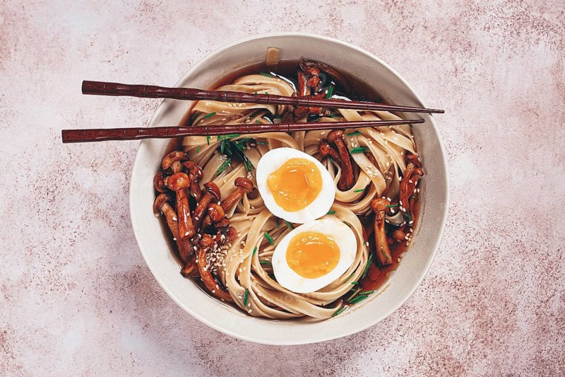 Buckwheat noodles soba with shimeji mushrooms, with boiled egg, green onion, sesame seeds, homemade, without people