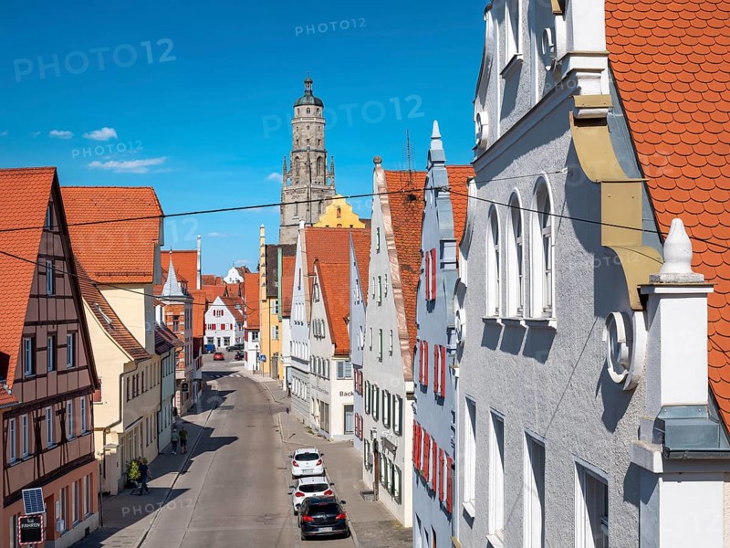 View from the medieval town wall over the houses of the historic old town to the tower of St George's Church, called Daniel, Nördlingen, Bavaria, Germany