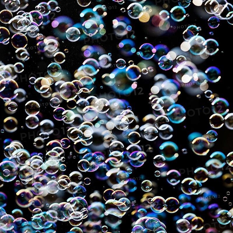 Many, small iridescent and floating soap bubbles against a black background, Recklinghausen, North Rhine-Westphalia, Germany