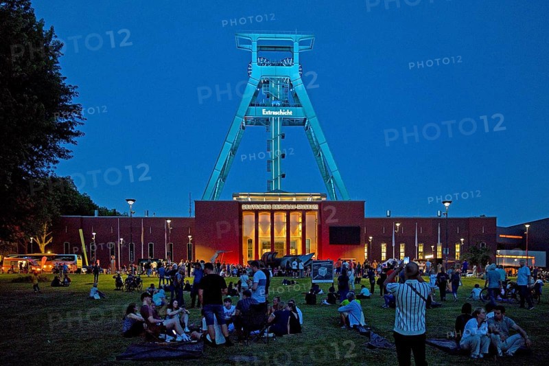 People in front of the German Mining Museum for the Extra Shift at night, Bochum, Ruhr Area, North Rhine-Westphalia, Germany