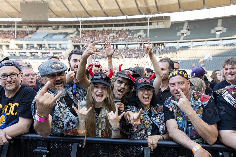 Fans in the front row in front of the concert of AC/DC live on Power Up Tour 2025 at the Olympiastadion Berlin on 30 June 2025