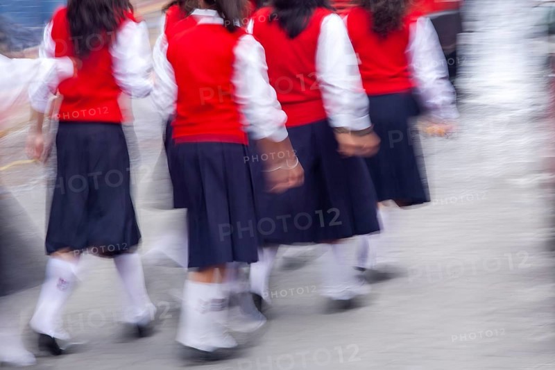 Group of female students walking to the college, Motion blur, City of Otavalo, Imbabura province, Ecuador, South America