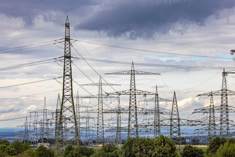Many high-voltage power lines and lattice towers in the district of Ludwigsburg near Besigheim, Baden-Württemberg, Germany
