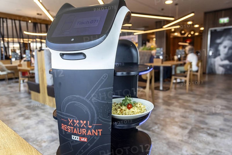 Furniture store XXXLutz Mann Mobilia Karlsruhe. In the restaurant, serving robot Lutzi supports the staff and brings the food to the table. Karlsruhe, Baden-Württemberg, Germany