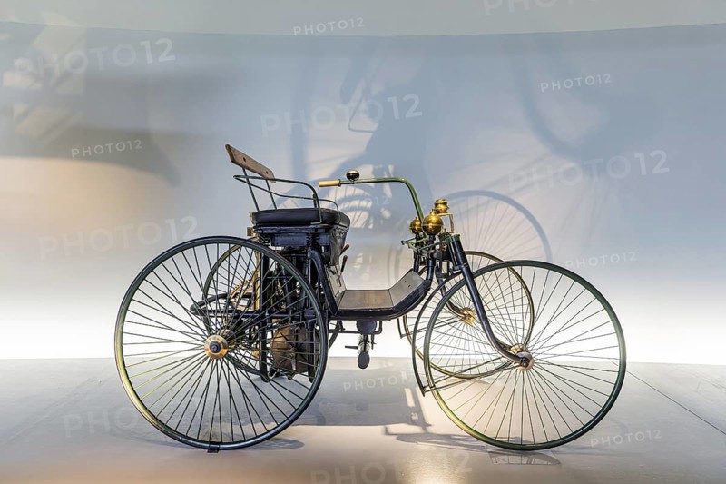 Daimler Motor-Quadricycle steel-wheeled carriage from 1889. The Mercedes-Benz Museum in Stuttgart presents a journey through the automotive history of the global corporation. The history of the Mercedes star begins with the first automobile in 1886. 160 vehicles are on display. Stuttgart, Baden-Württemberg, Germany