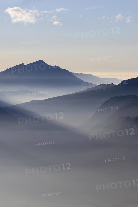 Mountain silhouettes... Alpine peaks and mountain ranges in the Bavarian Alps, light fog rises from the valleys, which creates an idyllic atmosphere in the light of the low sun, romantic view from Oberstdorf towards Kleinwalsertal, local nature, Bavaria, Allgäu, Allgäu Alps, Bavarian, Germany, Western Europe