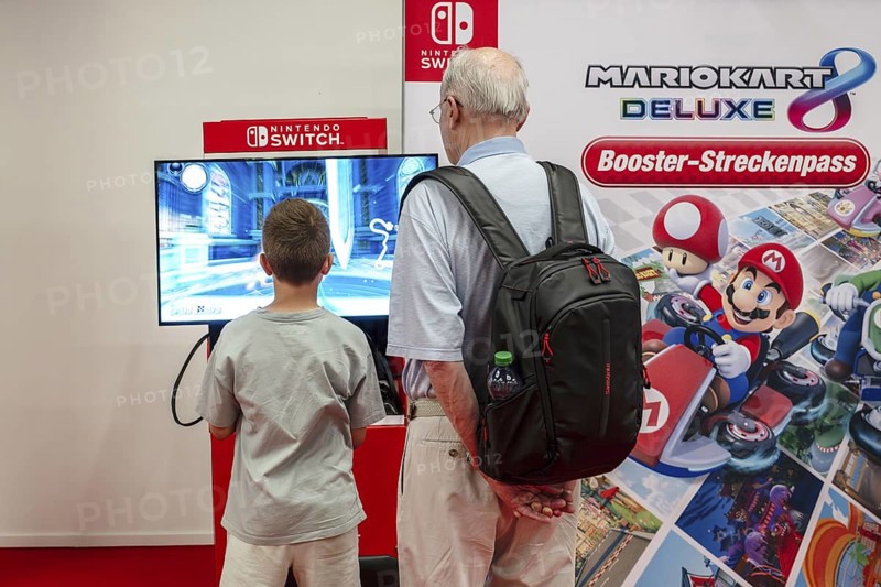 Symbol photo senior with boy playing games