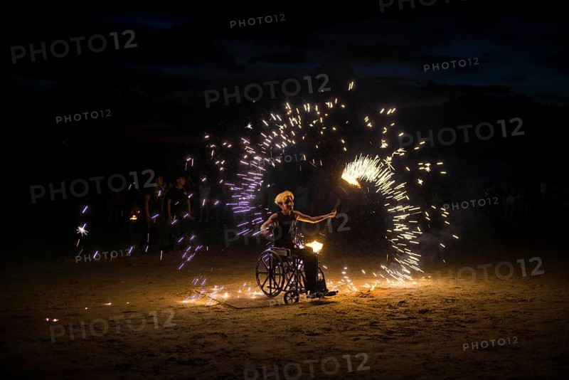 Fire show, jugglers with fire, wheelchair users, Ao Nang Beach, sunset, Ao Nang, Krabi, Thailand
