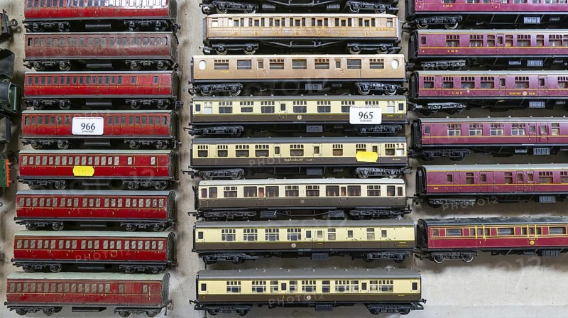 Model railway toy train set items on display for sale at auction room, UK