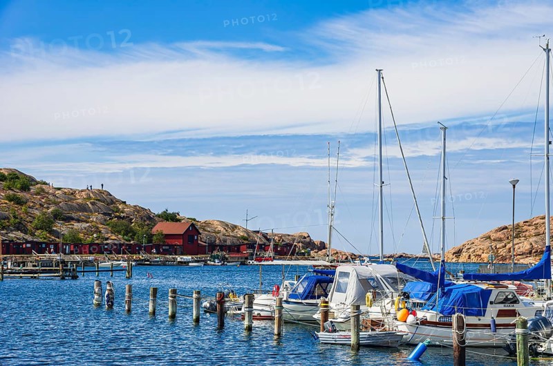Boats moored at the jetty in the marina in the northern harbour (Norra Hamnen) of Lysekil, Bohuslän, Västra Götalands län, Sweden, Scandinavia, for editorial use only