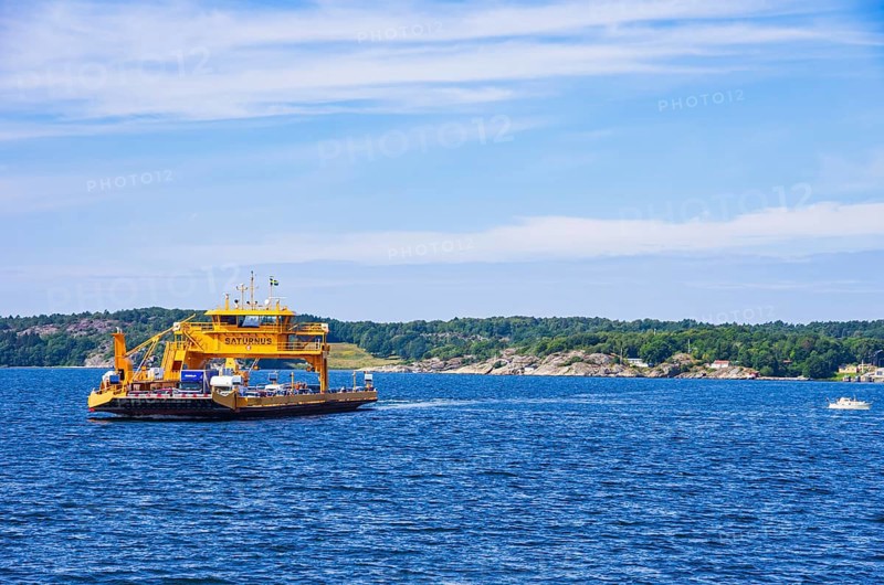 The car ferry SATURNUS, which operates as a floating road between the archipelago, navigates off the coast near Lysekil, Bohuslän, Västra Götalands län, Sweden, Scandinavia