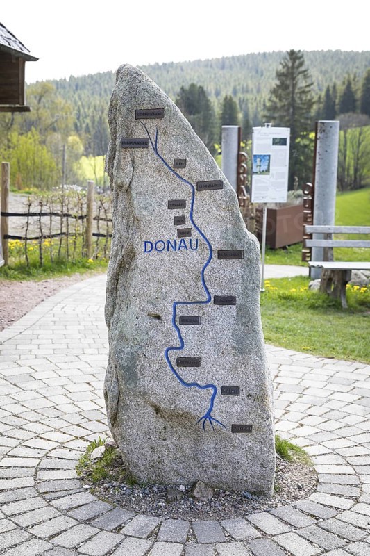 Stone showing the course of the Danube from its source to its mouth near the source of the Danube in Furtwangen in the Black Forest, Baden-Württemberg, Germany
