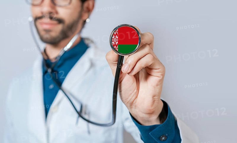 Doctor holding stethoscope with Belarus flag. Belarus health and care concept, Belarus flag on stethoscope