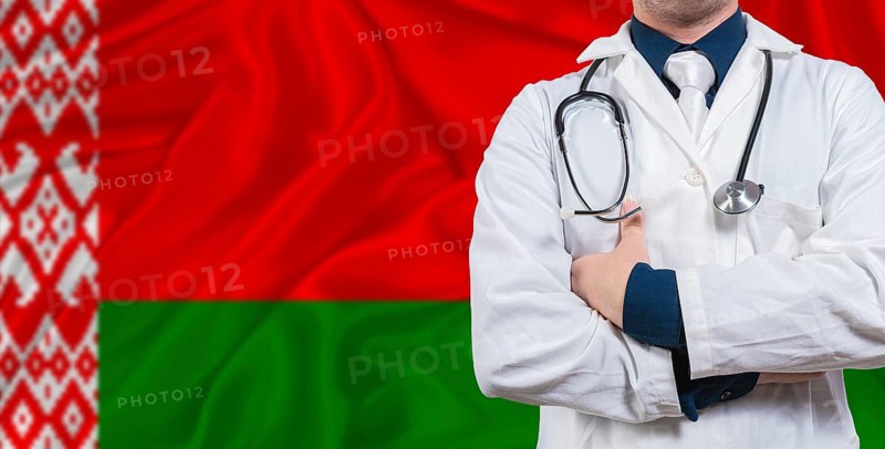 Male doctor with stethoscope on Belarus flag. Doctor holding stethoscope on Belarus flag
