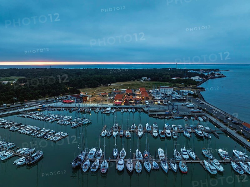 Sunset over Marina in Le Verdon-sur-Mer from a drone, Nouvelle-Aquitaine, Gironde, France, EuropeLe Verdon-sur-Mer, Nouvelle-Aquitaine, Gironde, France, Europe