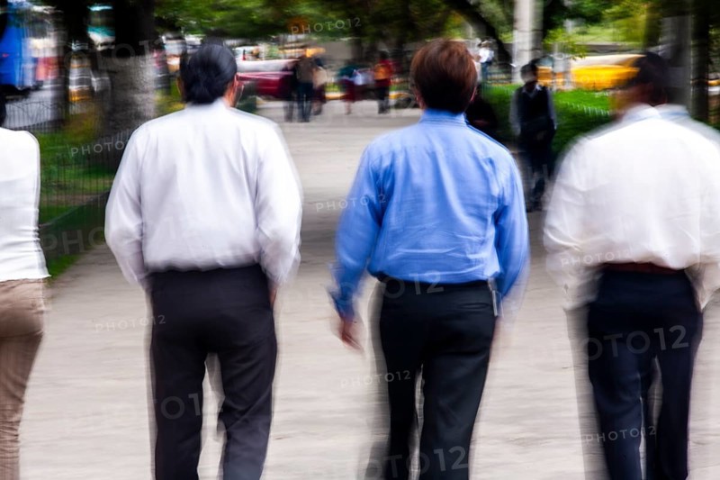Men walking in street, Photo with motion blur, City of Quito, Pichincha province, Ecuador, South America