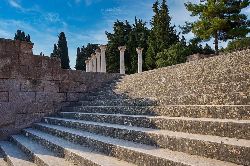 Stone staircase with old columns, framed by trees under a blue sky, open staircase to the second terrace, Asklipion, Asklepieion, healing temple, temple, Hippocrates, Kos, Dodecanese, Greek Islands, Greece