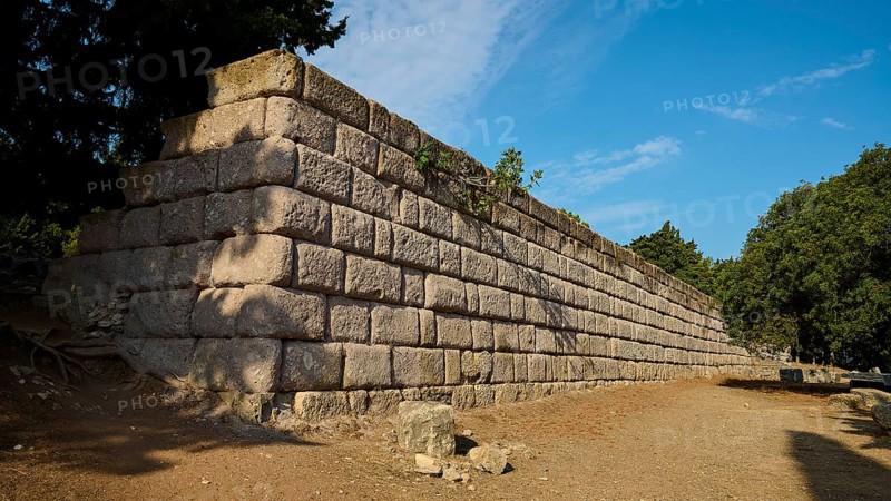 Stone wall in a natural setting with clear blue sky, Wall Upper Terrace, Asklipion, Asklepieion, Healing Temple, Temple, Hippocrates, Kos, Dodecanese, Greek Islands, Greece