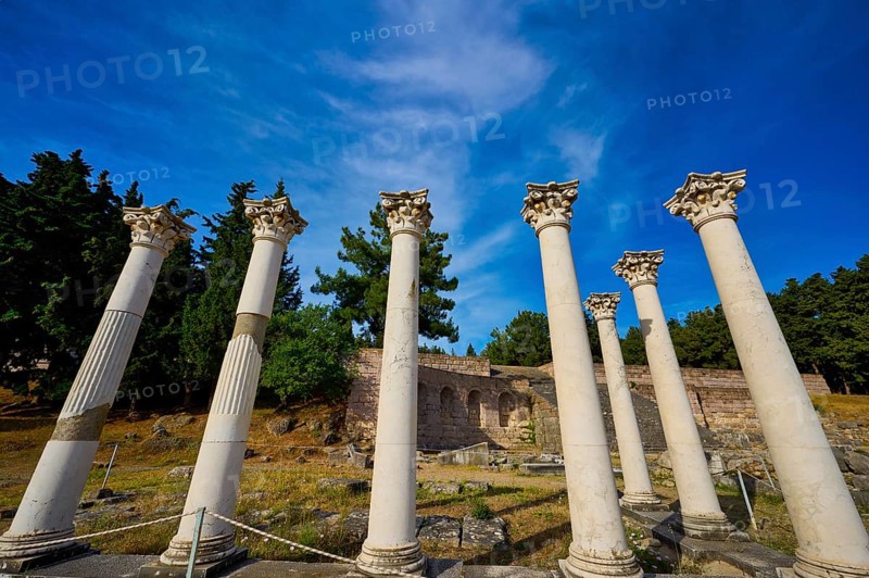 Ancient columns grouped in front of a blue sky and bulbous trees, Temple of Apollo, Corinthian Columns, Asklipion, Asklepieion, Healing Temple, Temple, Hippocrates, Kos, Dodecanese, Greek Islands, Greece