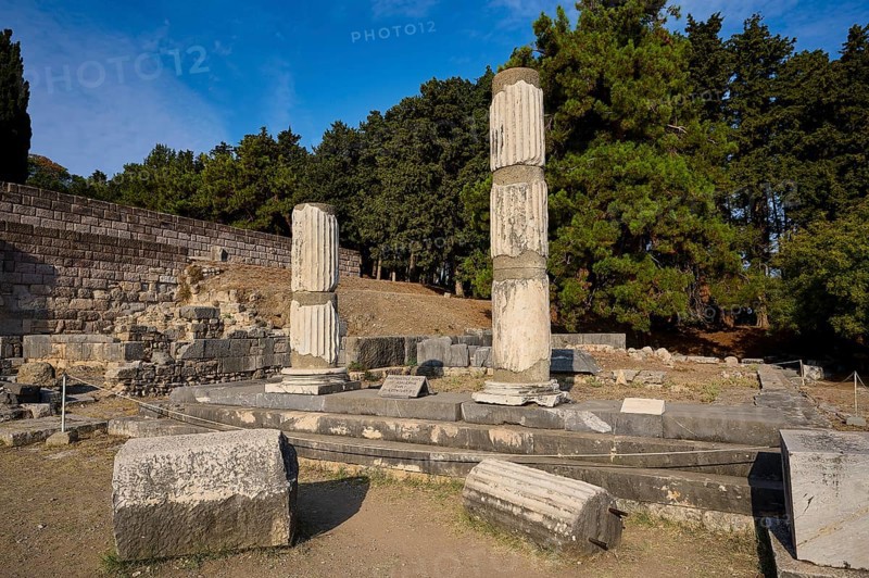 Two damaged columns stand in a historic site surrounded by trees, Asklepios Temple, Asklipion, Asklepieion, Healing Temple, Temple, Hippocrates, Kos, Dodecanese, Greek Islands, Greece