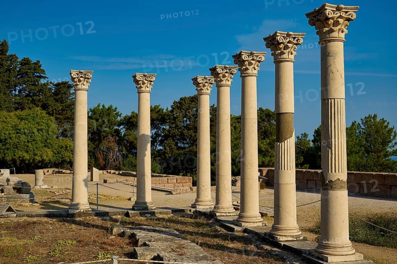 Row of ancient columns in a landscape of ruins with trees in the background, Temple of Apollo, Corinthian Columns, Asklipion, Asklepieion, Healing Temple, Temple, Hippocrates, Kos, Dodecanese, Greek Islands, Greece