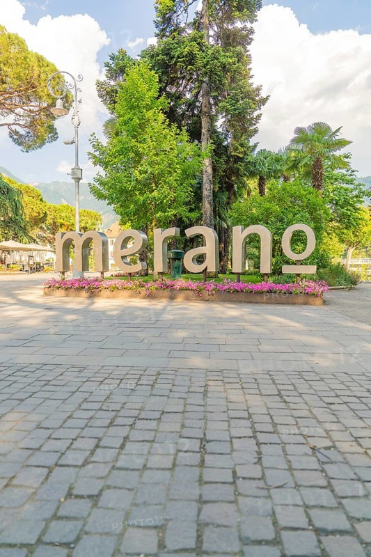 Large lettering 'Merano' in a park decorated with flowers, Merano, Italy