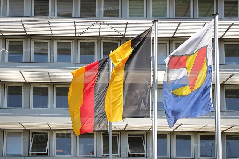 Three flags at the job centre, modern building with window, national flag, Baden-Württemberg state flag and city flag with city coat of arms, city administration, Pforzheim, Northern Black Forest, Black Forest, Baden-Württemberg, Germany