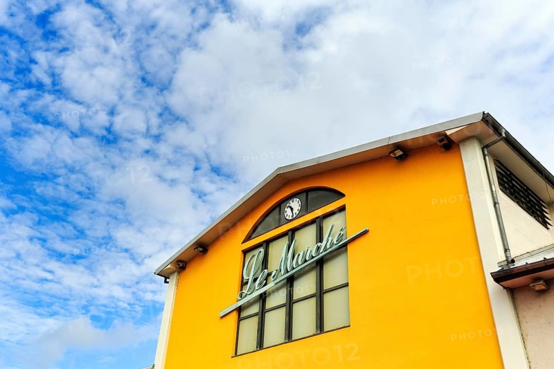 Market hall with inscription Le Marché, yellow facade detail, Mulhouse, Alsace, France