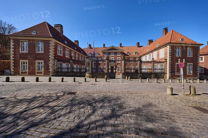 Episcopal Vicariate General, vicariate, brick building, bollards, cobblestone pavement, blue cloudless sky, cathedral square, Münster, Münsterland, independent city, North Rhine-Westphalia, Germany