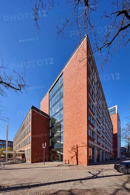 Stadthaus 1, city centre, brick building, bare wintry trees, blue cloudless sky, Heinrich-Brüning-Straße, Münster, Münsterland, independent city, North Rhine-Westphalia, Germany